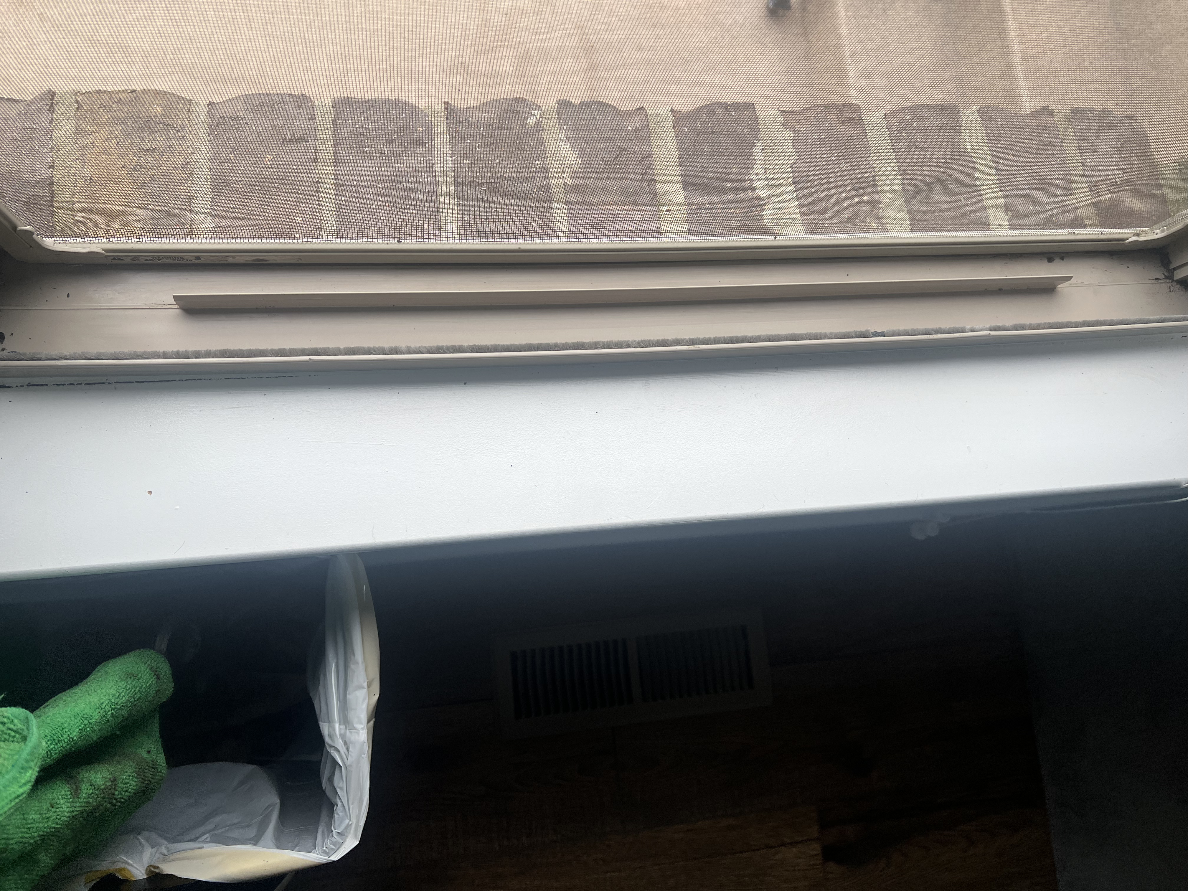 Dirty window track with accumulated debris and grime
